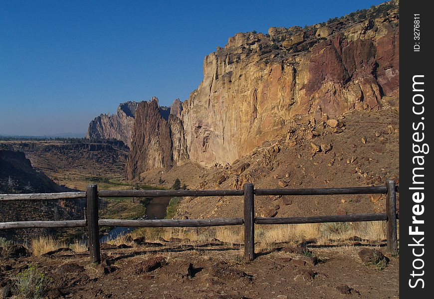 Standing behind the fence at Smith Rock State Park in Central Oregon. Standing behind the fence at Smith Rock State Park in Central Oregon