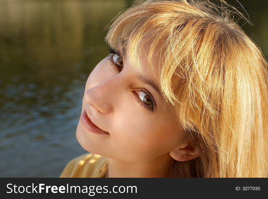 Beautiful blond girl in the park area. Beautiful blond girl in the park area