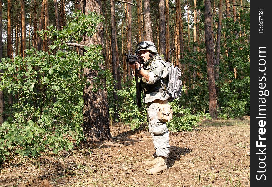 Soldier in ACU holding the Colt M4 carbine with M203 grenade launcer. Soldier in ACU holding the Colt M4 carbine with M203 grenade launcer