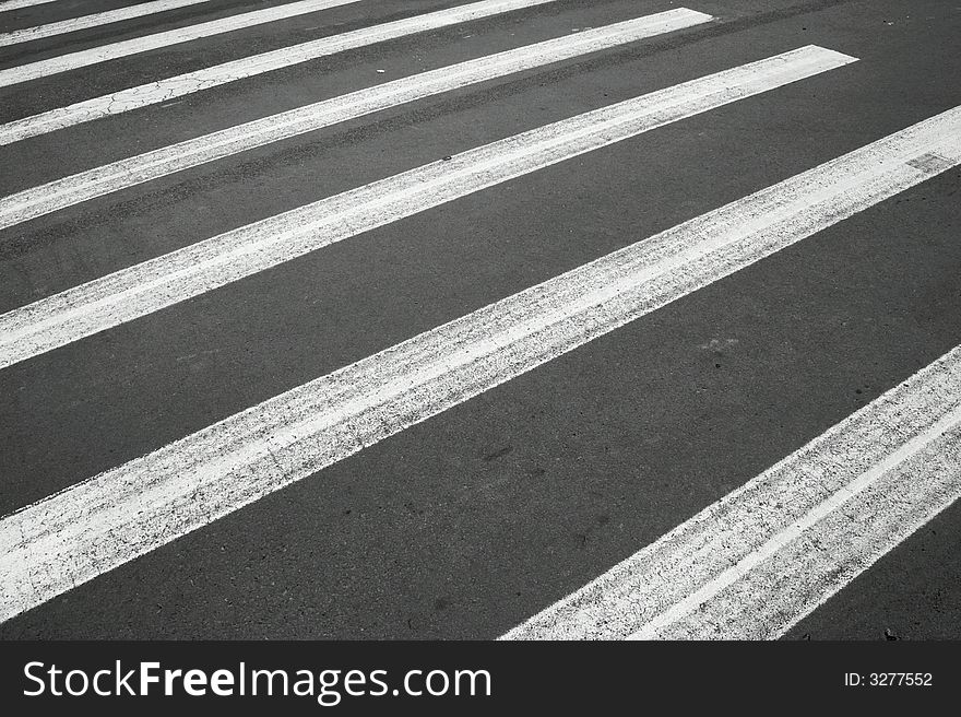 White painted pedestrian crossing on the road