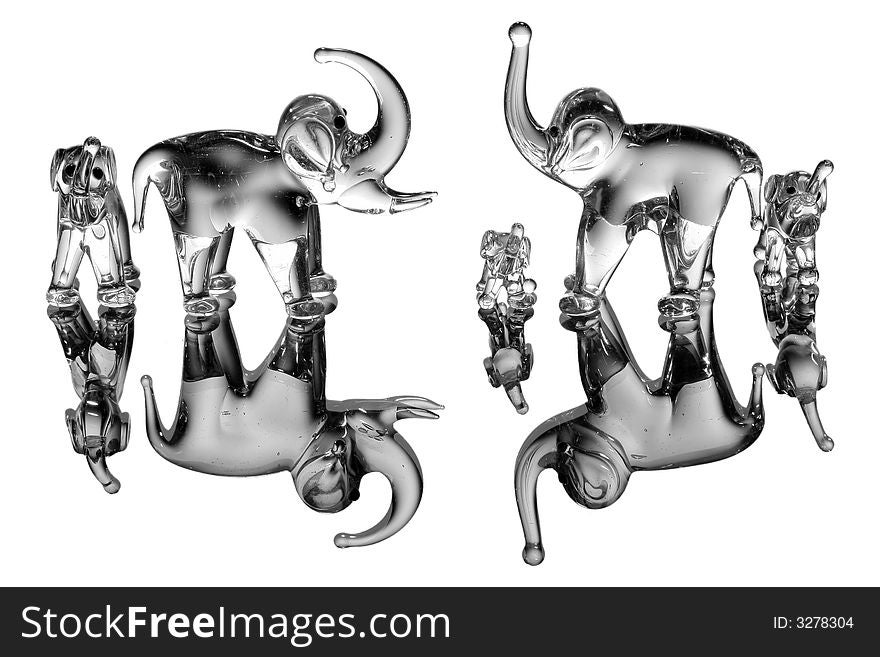 Elephant statues on white with reflection