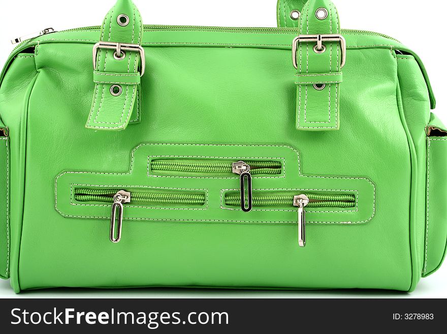 Close up at face of nice green handbag with zippers. Close up at face of nice green handbag with zippers