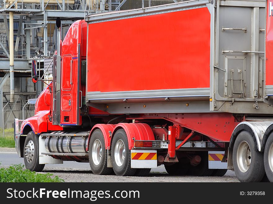 Red heavy articulated semi truck