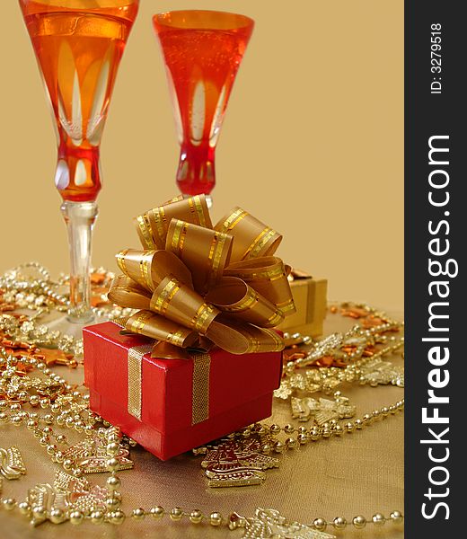 Gift box on a beautiful background with glasses. Gift box on a beautiful background with glasses