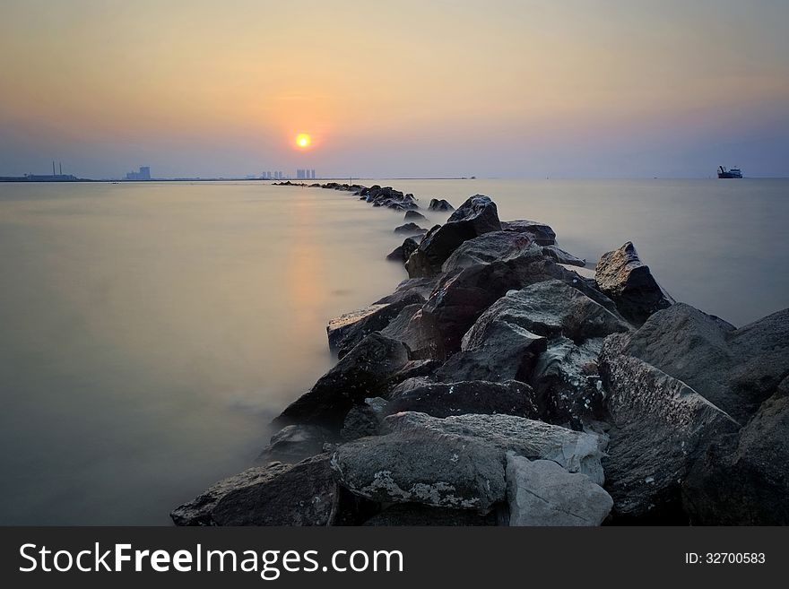 The rocks, beach and the sunset - long exposure. The rocks, beach and the sunset - long exposure