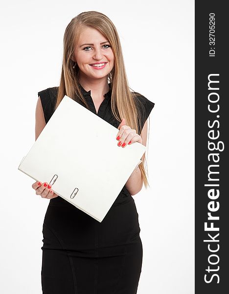 Young businesswoman holding a large file, looking happy. Isolated on white. Young businesswoman holding a large file, looking happy. Isolated on white