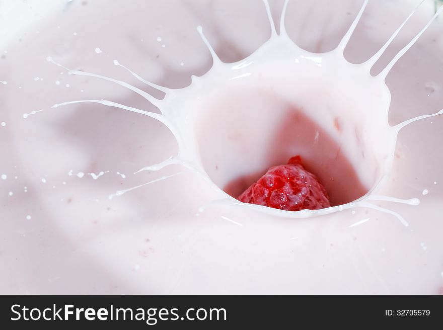 Close up of splashing raspberry yogurt. Close up of splashing raspberry yogurt