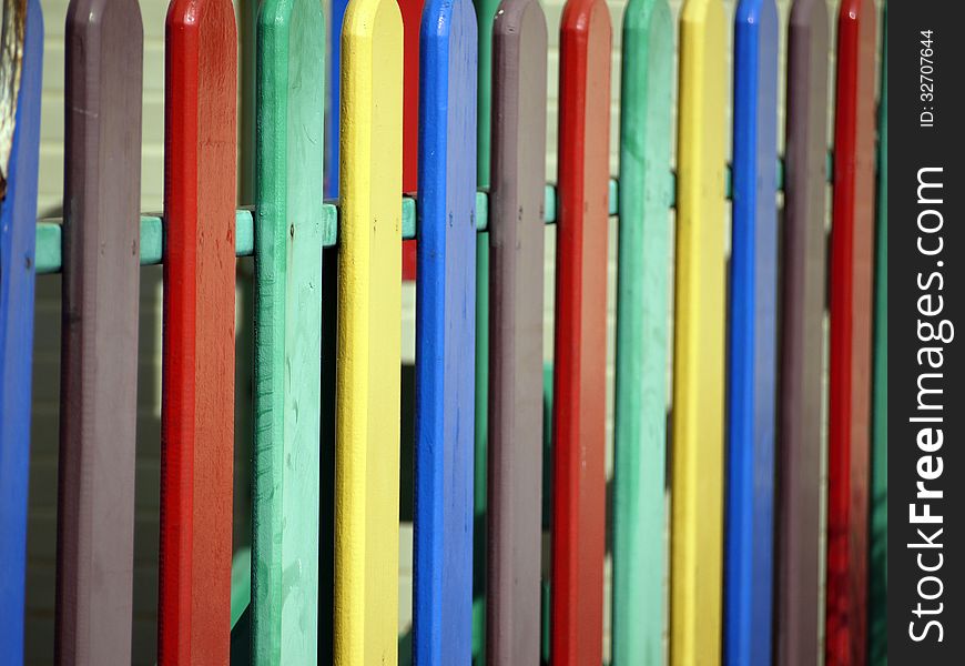 A bright multicolored wooden fence as a background