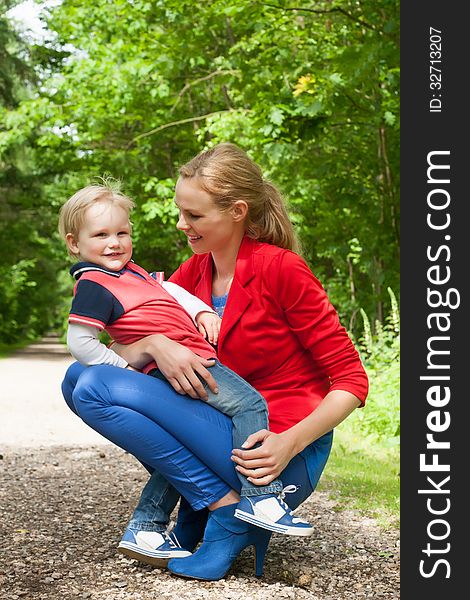 Happy mother and son having a nice day in the park