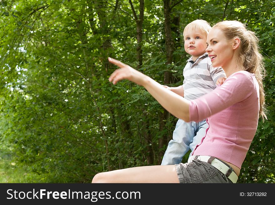 Happy mother and son having a nice day in the park. Happy mother and son having a nice day in the park