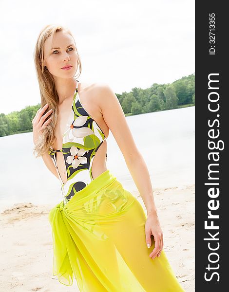 Beautifull model in bikini on the beach with sunny weather. Beautifull model in bikini on the beach with sunny weather