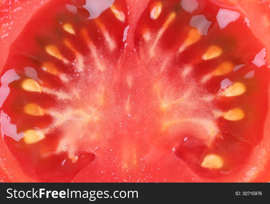 Slice Of Tomato Isolated On A White Background