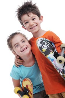 Cute Boy And Girl Are Carring Skateboards Stock Image