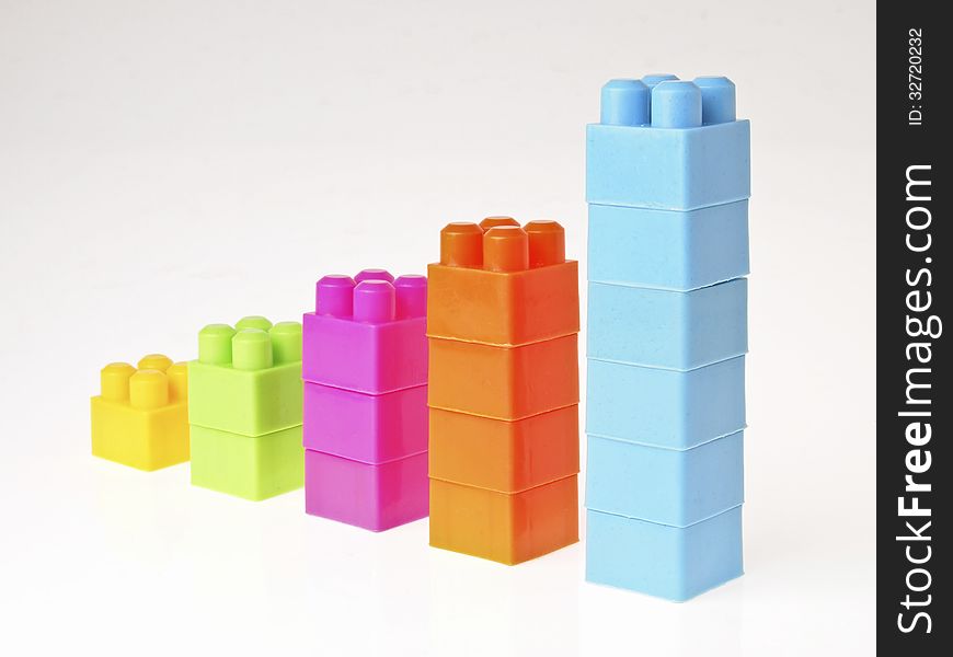 Perspective of increase color column in brick toy style on white background. Perspective of increase color column in brick toy style on white background