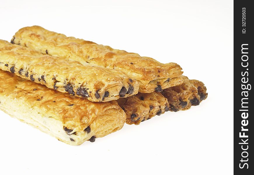 Pile of stick bread with chocolate chip inside on white background