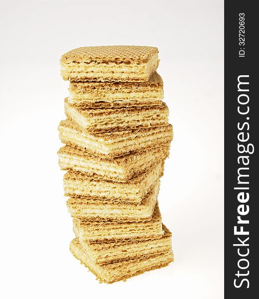 High stack tower of wafers candy on white background. High stack tower of wafers candy on white background