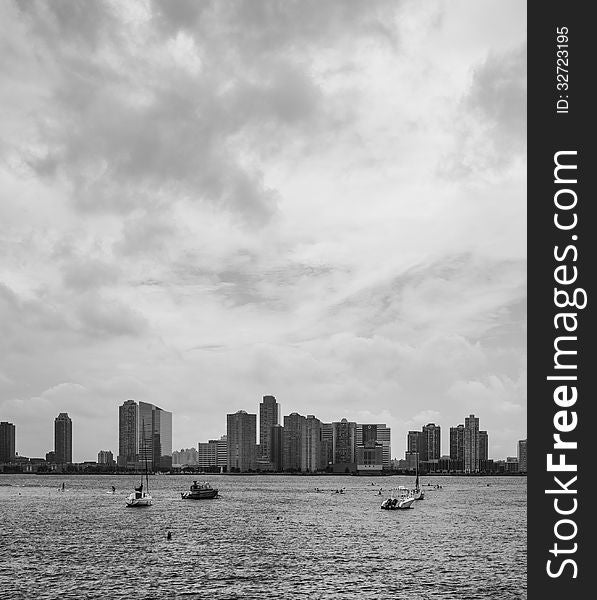 A Black & White image of boaters enjoying the Hudson River Overlooking New Jersey City. A Black & White image of boaters enjoying the Hudson River Overlooking New Jersey City