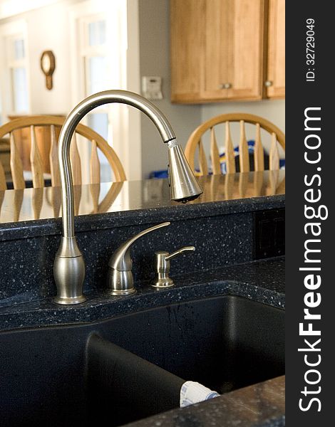 Stainless steel kitchen sink shown in the home setting.