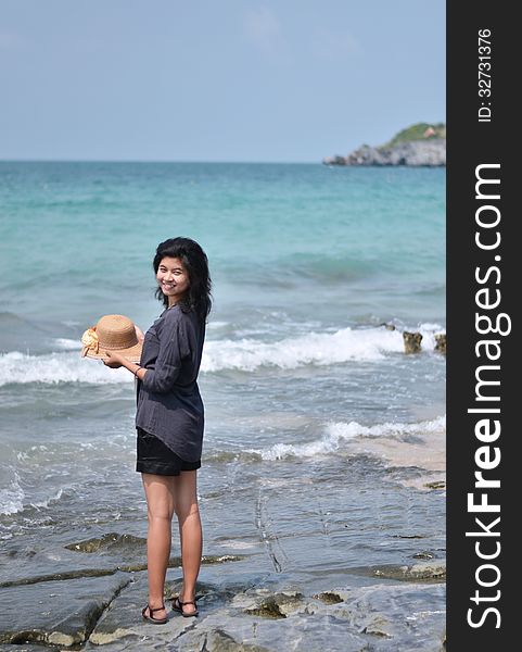 Beautiful Asian girl smiling at the beach, Si Chang island, Thailand