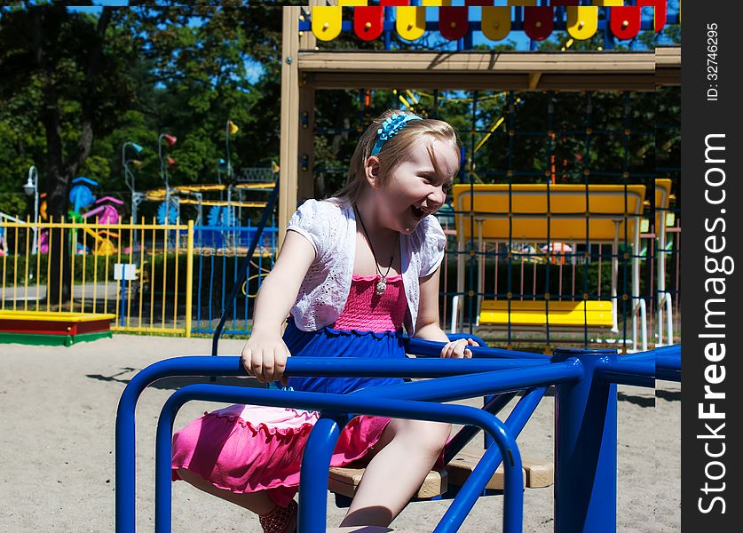 Girl Riding On A Carousel