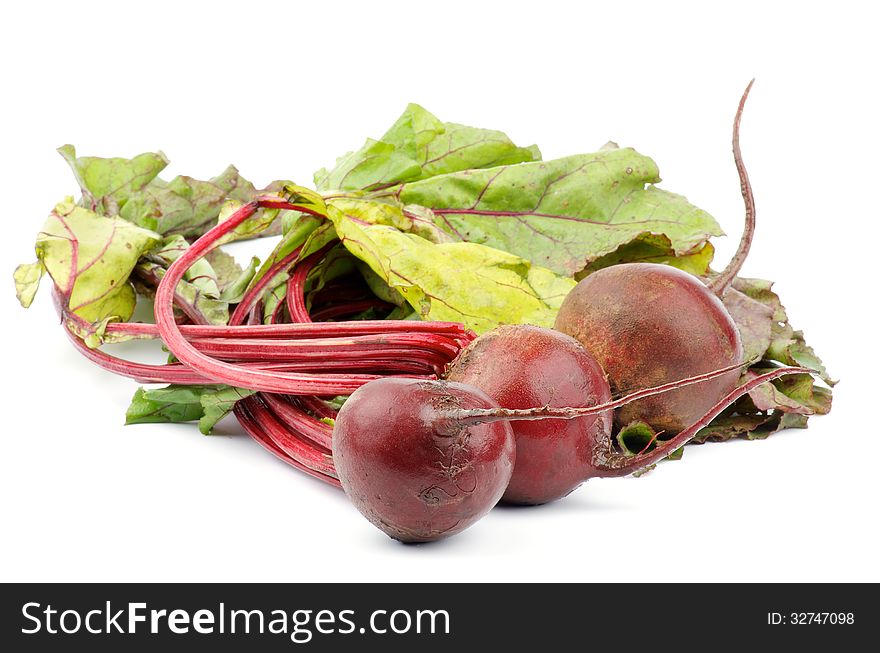 Heap of Fresh Raw Beetroots with Leafy Tops isolated on white background