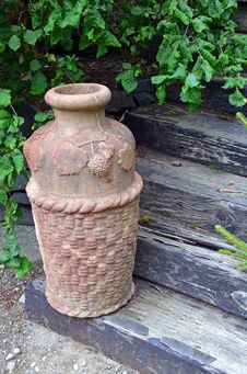 Decorative Urn On Wooden Stairs Royalty Free Stock Photo