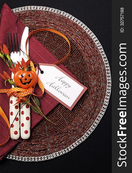 Happy Halloween table place setting with red polka dot cutlery - Vertical.