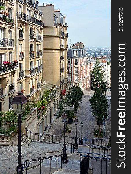 The buildings, architecture and apartments of Monmatre with the city of Paris in the background. The buildings, architecture and apartments of Monmatre with the city of Paris in the background.