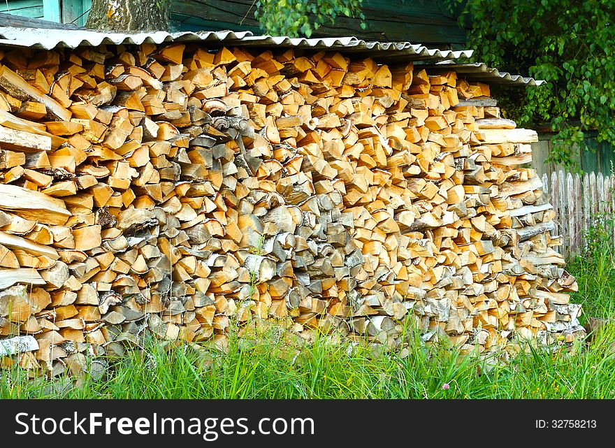 . Firewood in a large number of stacked in a pile