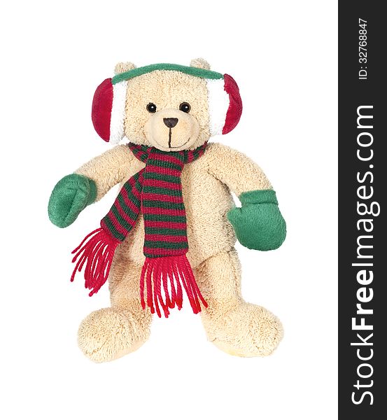 Christmas teddy bear isolated on a white background with a scarf and warm gloves.