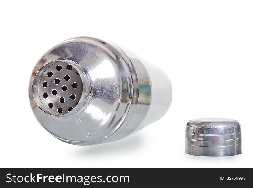 Empty silver shaker with the lid open lies on a white background