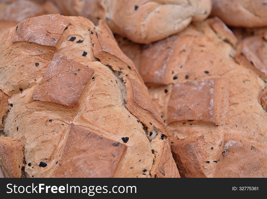 Traditional romanian brown bread with small pieces of berry