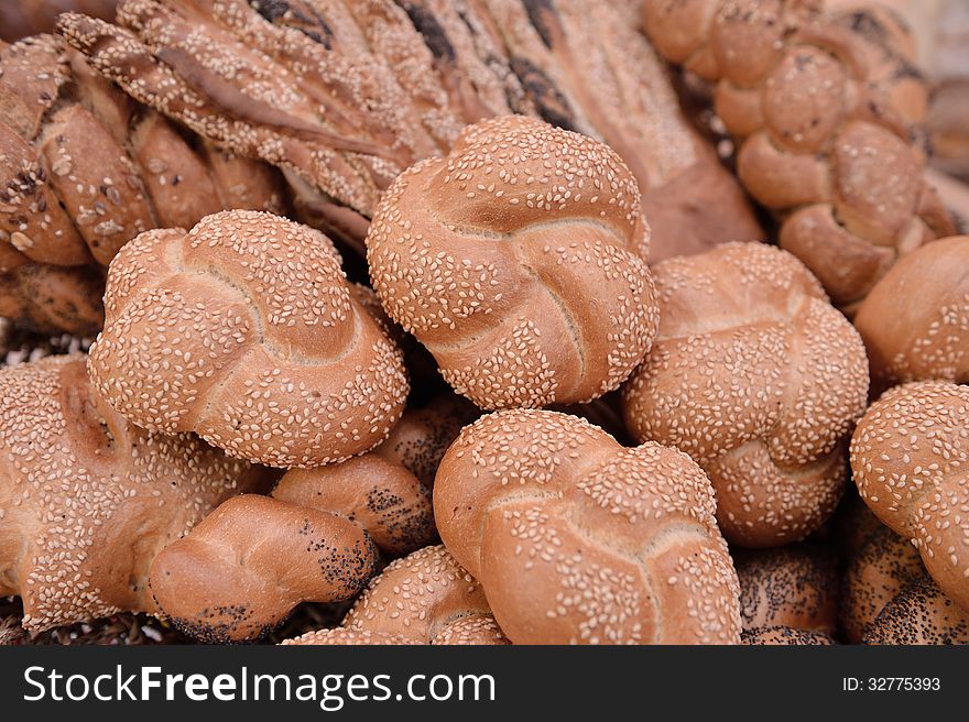 Variety of white bread with sesame seed and brown bread. Variety of white bread with sesame seed and brown bread