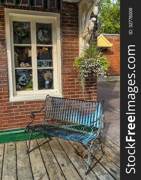 Metal bench in front of a boutique in Baie-St-Paul Quebec