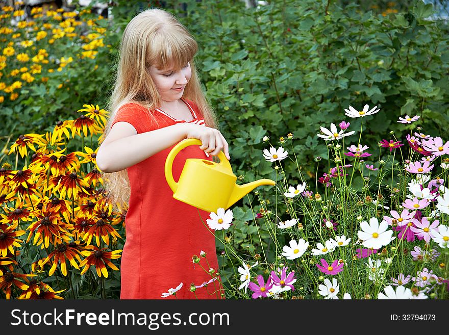 Little Girl Watering Flowers