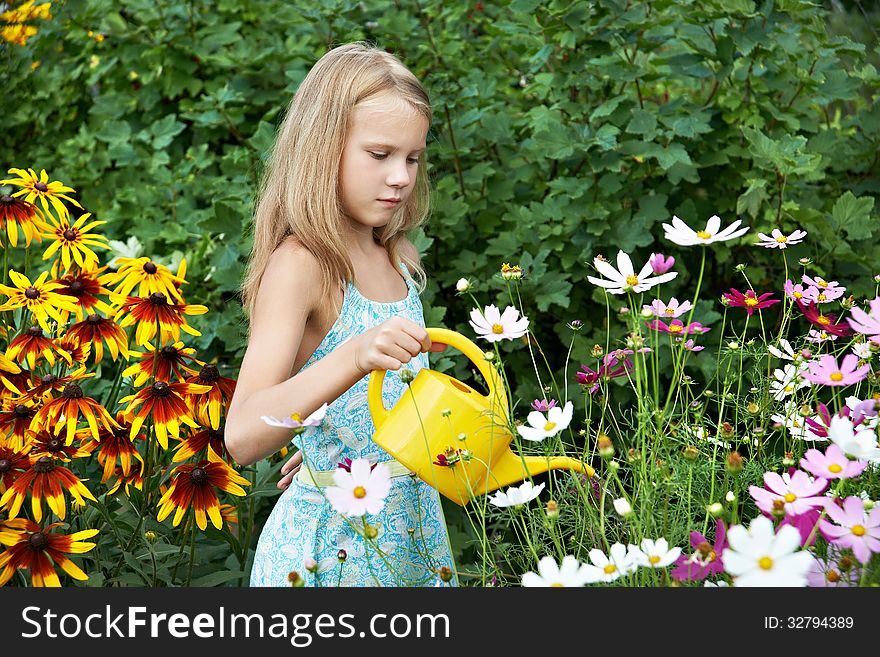 Little Girl Watering Flowers