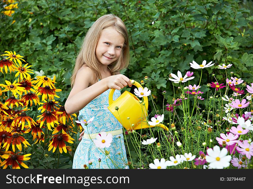 Little Girl Watering Flowers