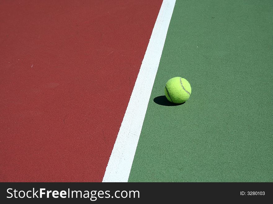 A Tennis Ball inbounds with white line