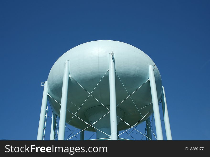 Blue Water Tower against a blue sky