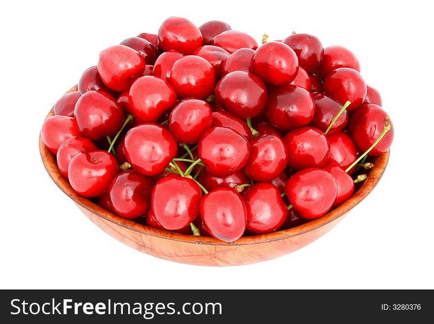 Cherry in bowl from wood, isolated on white background with clipping path.