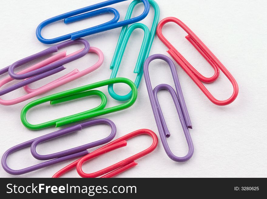 Multi colored Paper clips isolated on a white background.