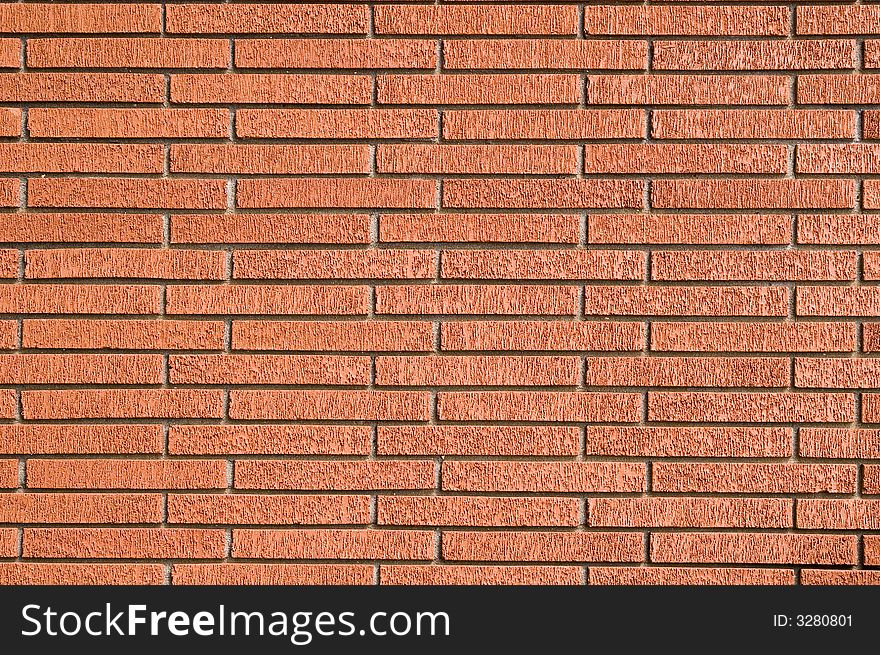 A Rough Red Brick Wall useful for backgrounds