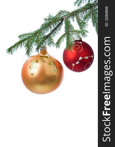 Christmas decoration ball and fir branch over white