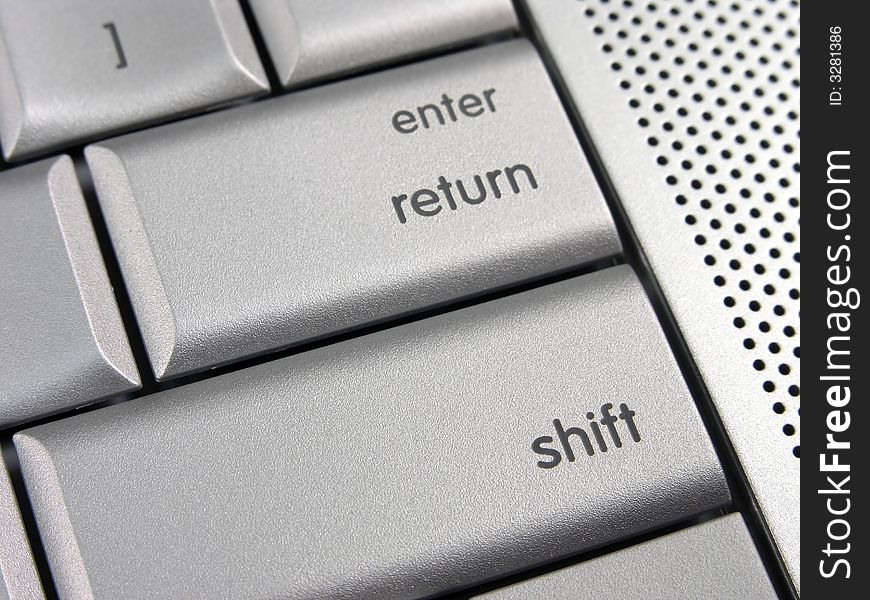 Silver laptop Return Shift key detail view