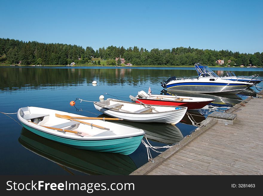 Boats docked in the swedish skargarden during daytime. Boats docked in the swedish skargarden during daytime