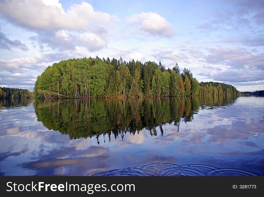 Trees reflect in river Vuoksa