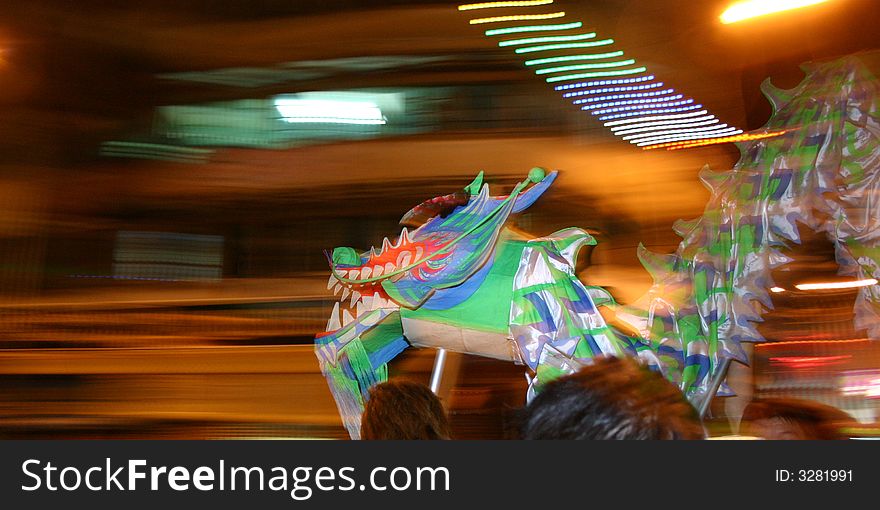 Panning photo of a puppet dagon at night. Panning photo of a puppet dagon at night