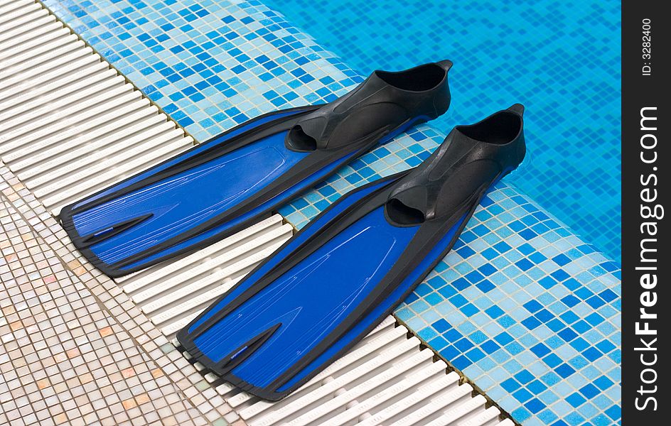 Blue Flippers In Swimming Pool