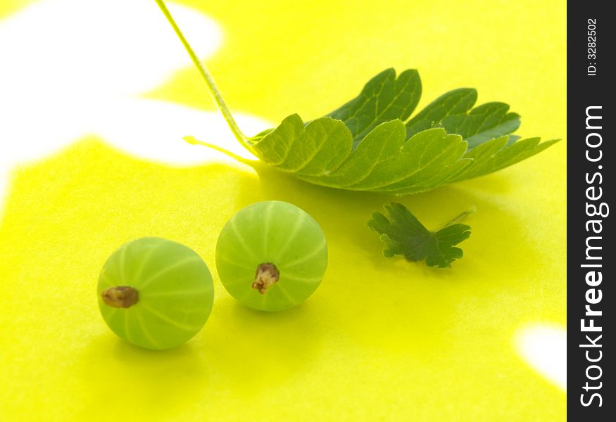 Goose berry on a yellow background