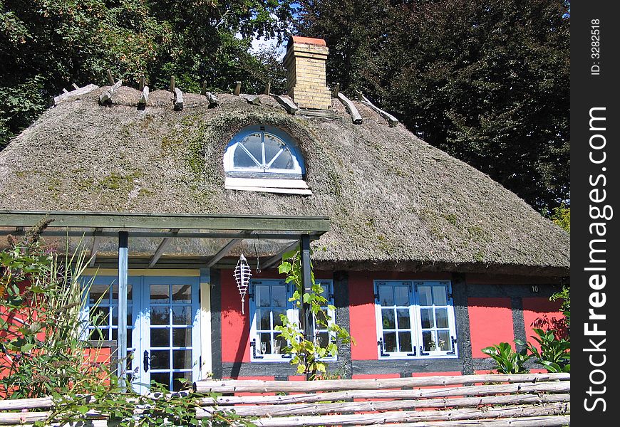 Danish old style typical country home with thached roof. Danish old style typical country home with thached roof